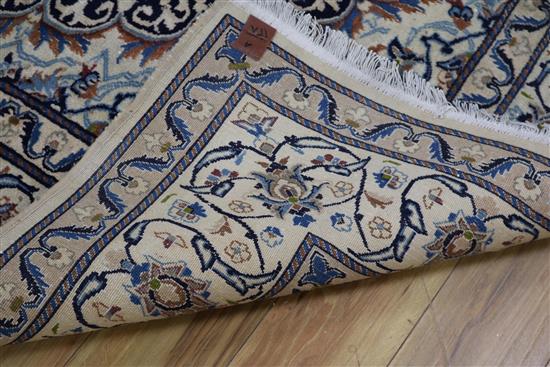 A Nain silk inlaid carpet, 295cm x 200cm.